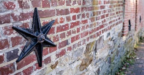 metal on side of old house|metal stars on american house.